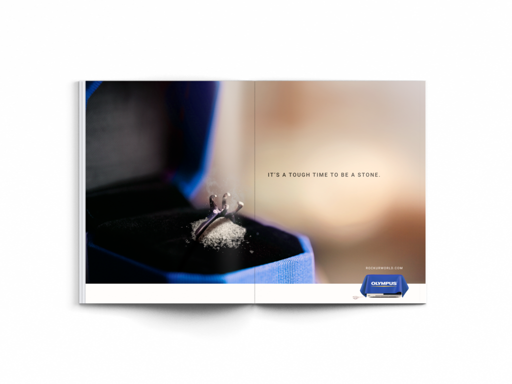 Image of a print advertisement mockup that shows a ring with the diamond turned to dust.